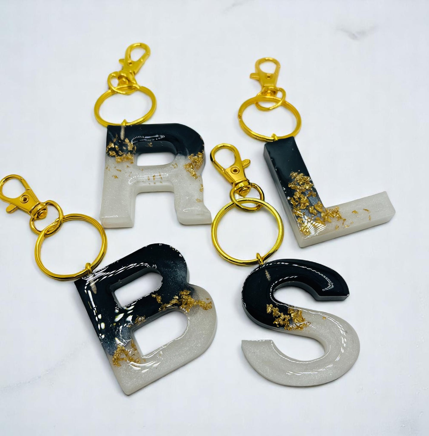 White and Black with Gold Flakes Resin Keychains