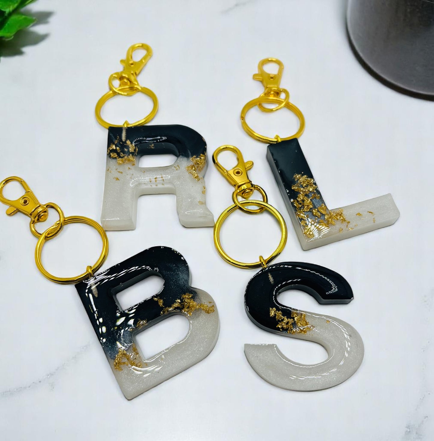 White and Black with Gold Flakes Resin Keychains